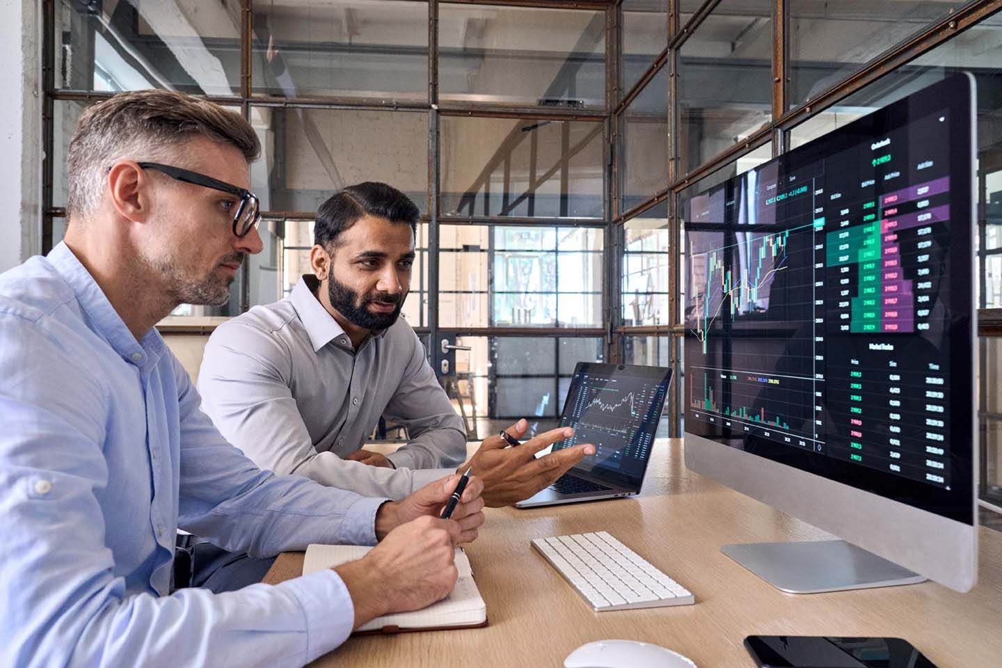 people reviewing digital reports